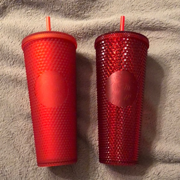 A set of the 2020 China red and 2020 matte red US Starbucks stud venti cups